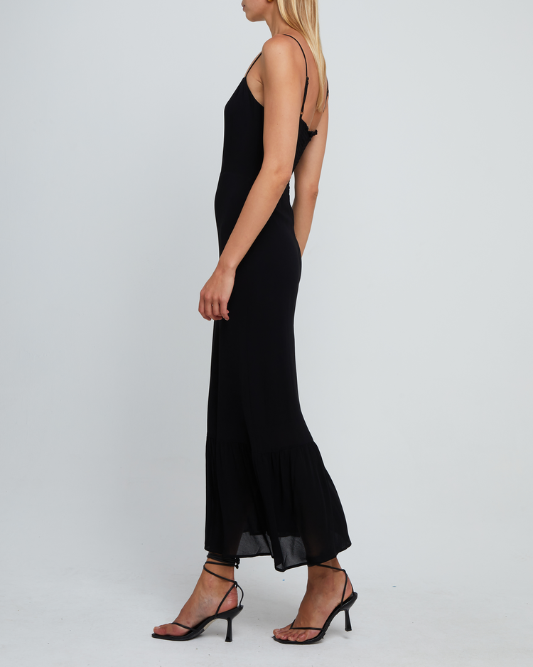 Fifth image of Evelyn Dress, a black bridesmaid maxi-length dress with ruched bust detail, sweetheart neckline, tiered skirt, back smocking, adjustable straps, back zipper, and lining