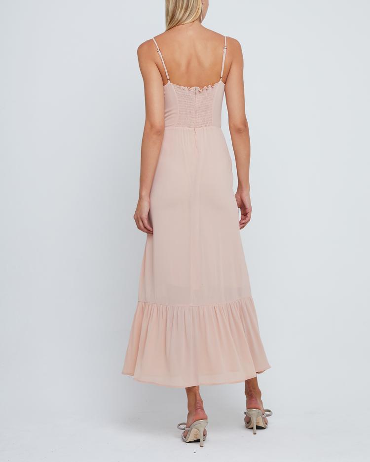 Second image of Evelyn Dress, a pink bridesmaid maxi-length dress with ruched bust detail, sweetheart neckline, tiered skirt, back smocking, adjustable straps, back zipper, and lining