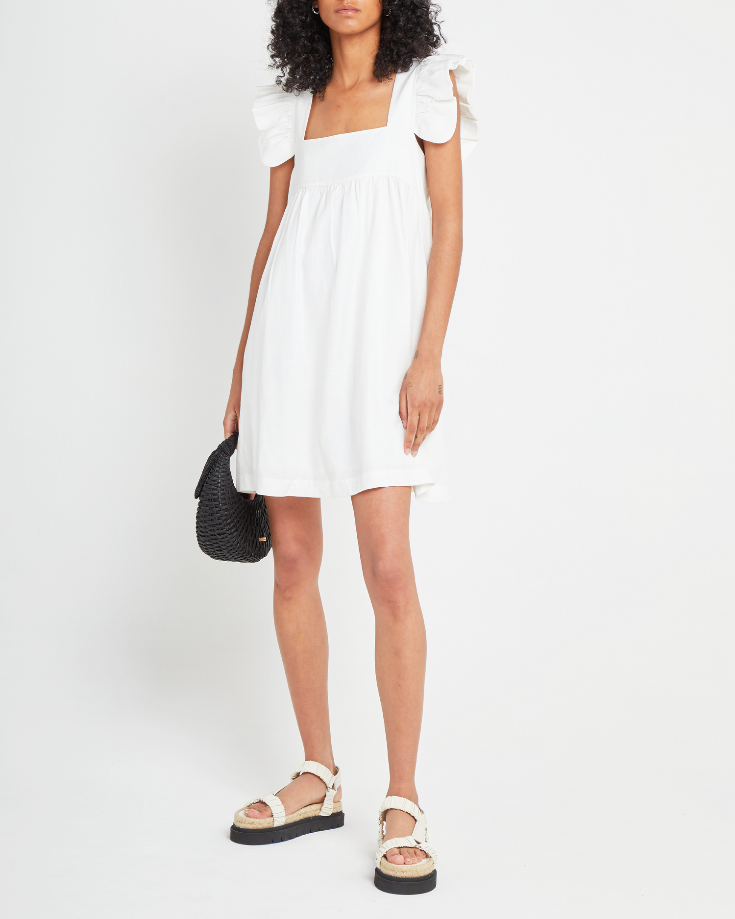 First image of Aria Dress, a white mini dress, ruffle sleeves, retro, babydoll, loose, relaxed, square neckline