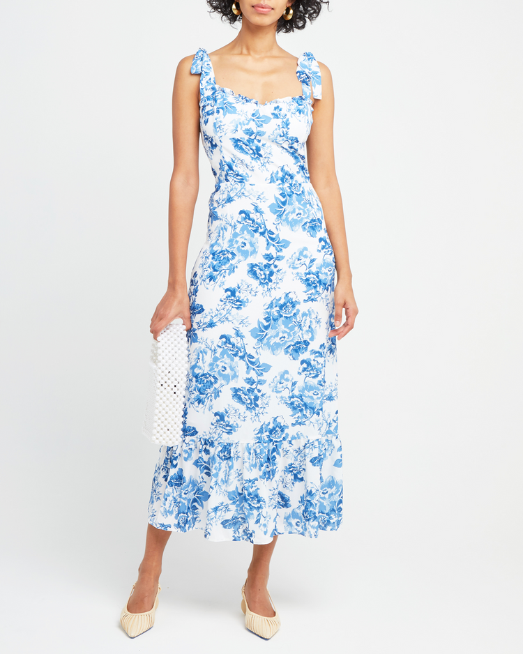 First image of Toile de Jouy Dress, a blue midi dress, tie straps, ruffle details, toile, bows