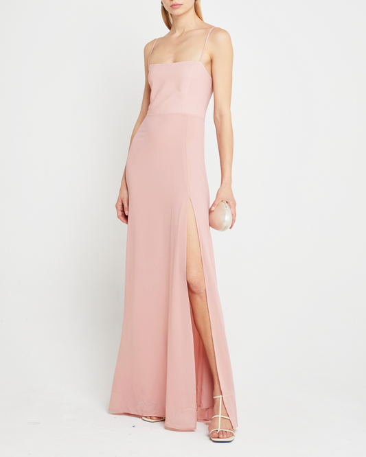 Third image of Jessica Maxi Dress, a pink wedding guest dress with back zipper, straight neckline, side slit, adjustable straps, smocked back detail, and lining