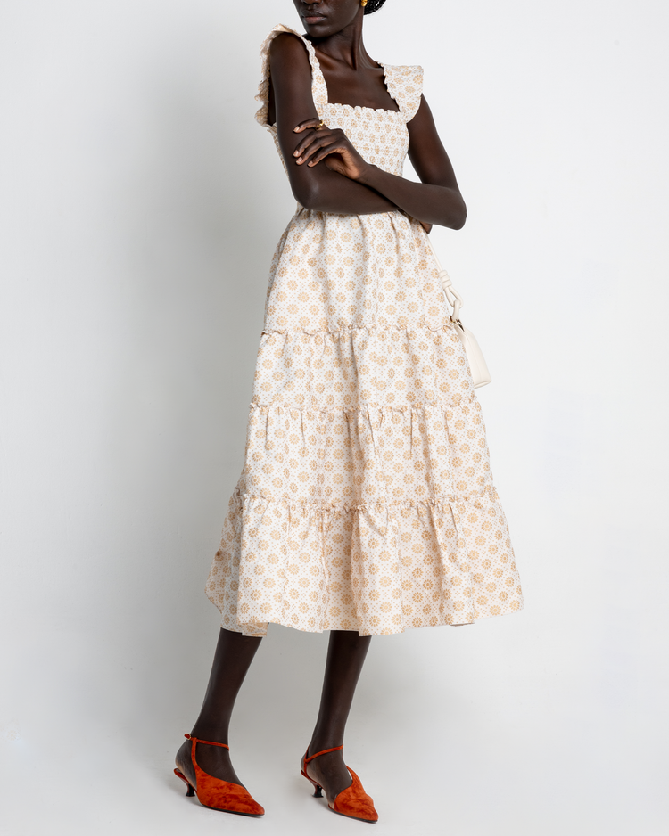 Fourth image of Calypso Maxi Dress, a white maxi dress, ruffle cap sleeves, smocked bodice, gold, floral