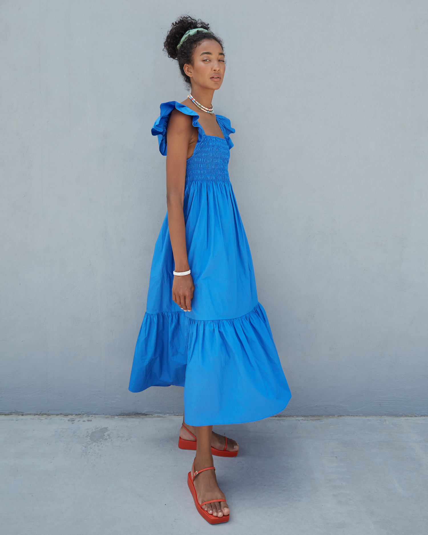 Third image of Tuscany Dress, a blue maxi dress, smocked bodice, ruffled cap sleeves, pockets