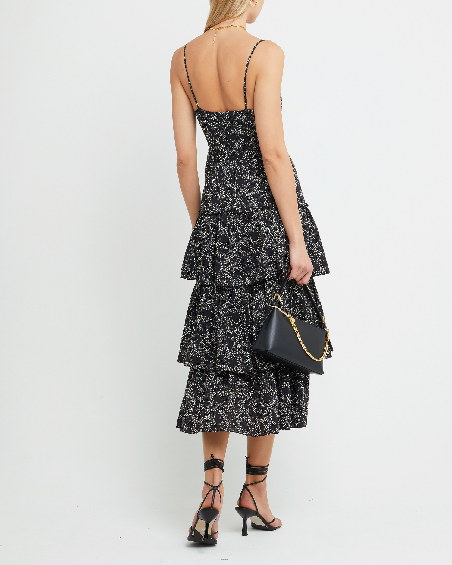 Second image of Nadira Dress, a black midi dress, tiered skirt, floral, spaghetti straps, cami