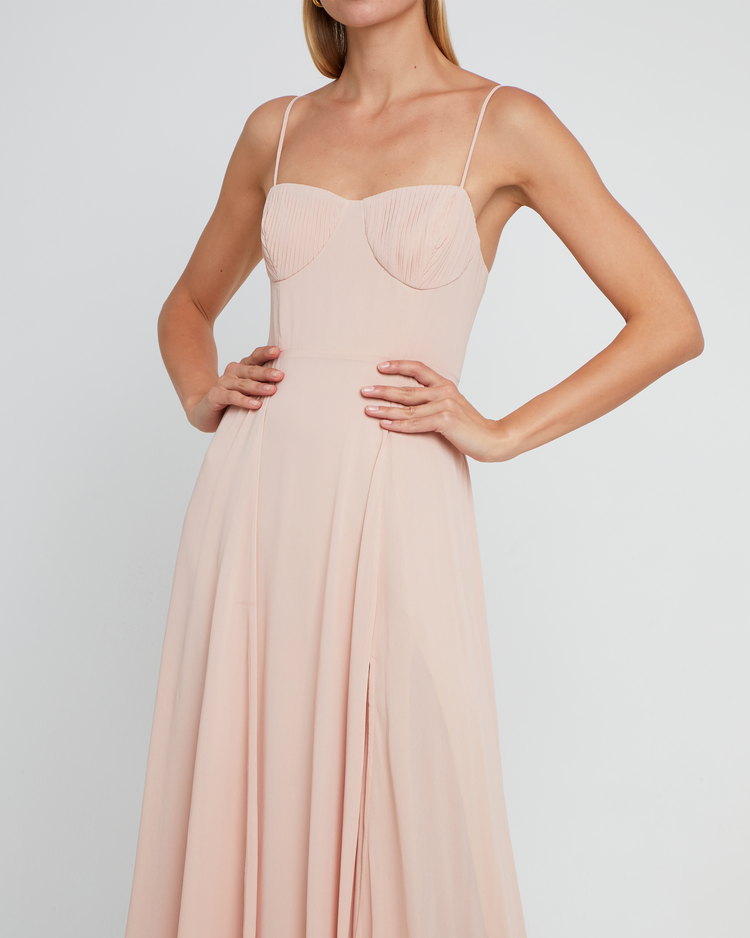 Fifth image of Winslow Dress, a pink bridesmaid dress with pleated cup detail, bustier style bodice, long flowy skirt, side slit, back zipper, adjustable straps, lining, and sweetheart neckline