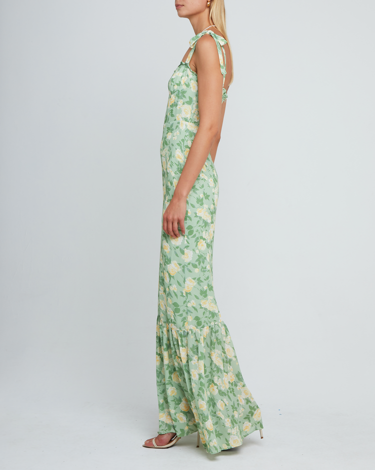 Fifth image of La Rue Dress, a sage floral floor-length bridesmaid dress with adjustable tie straps, cup detail, neckline ruffles, tiered skirt, lining, back smocking and back zipper