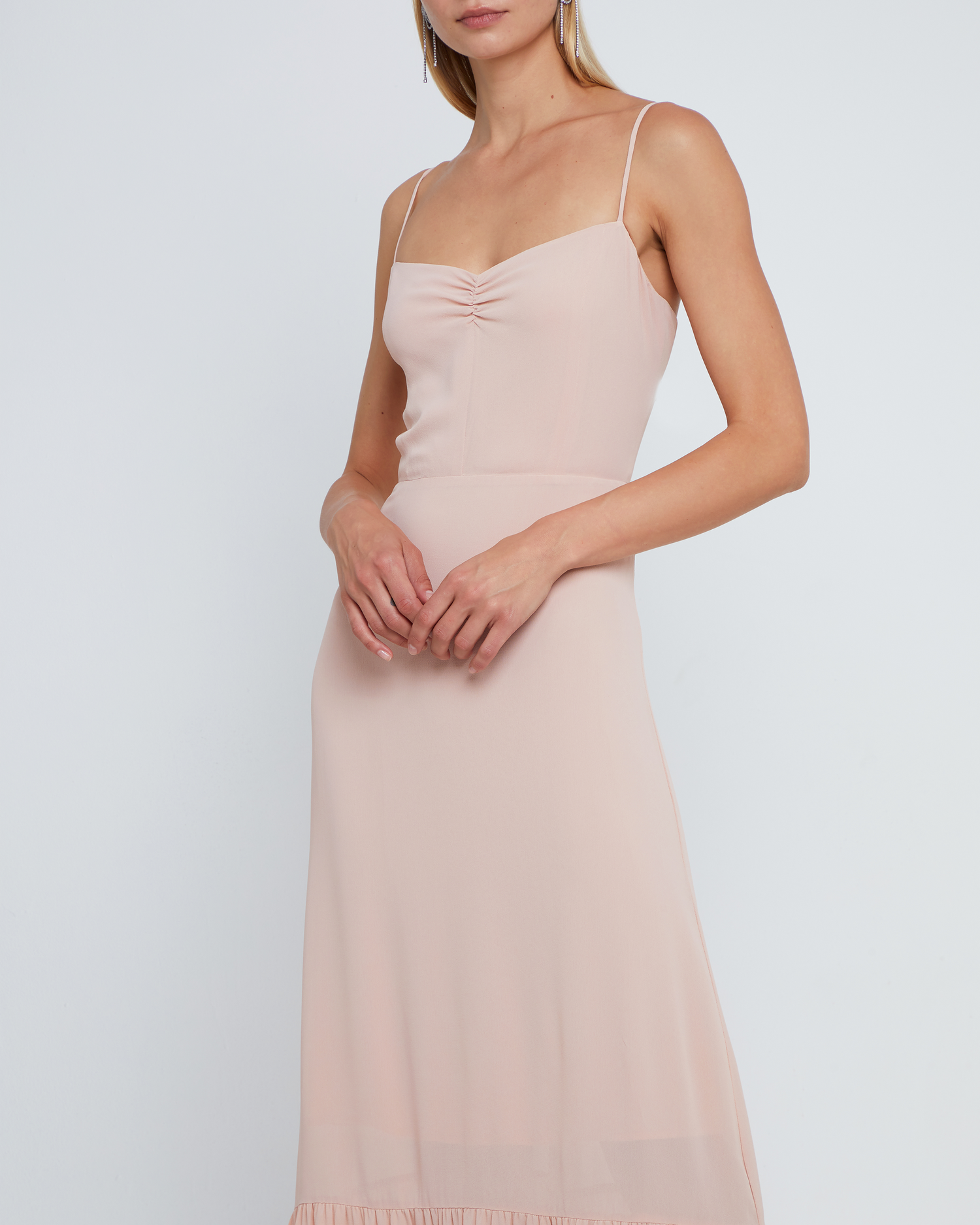 Fifth image of Evelyn Dress, a pink bridesmaid maxi-length dress with ruched bust detail, sweetheart neckline, tiered skirt, back smocking, adjustable straps, back zipper, and lining